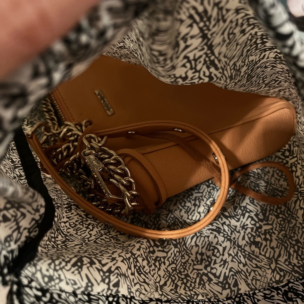 Rebecca Minkoff bag. Lots of pockets and space with the cutest fringe zippers!